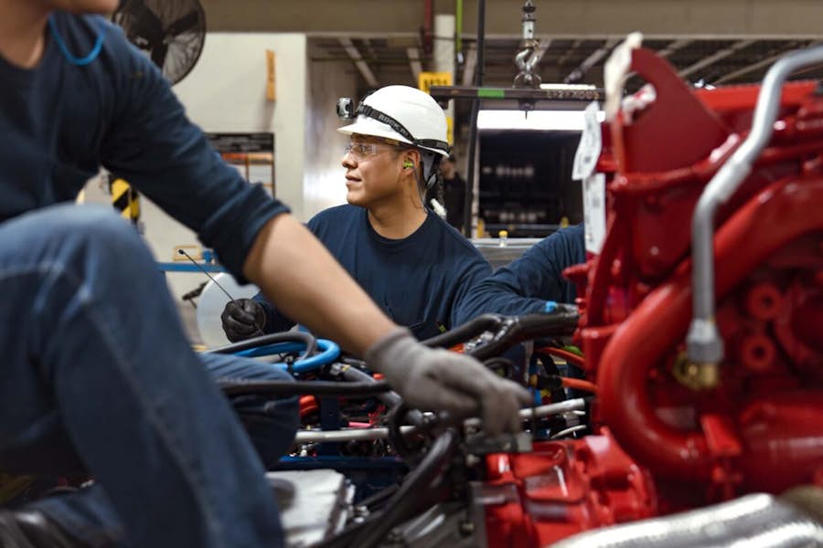 A group of people working on a machine
