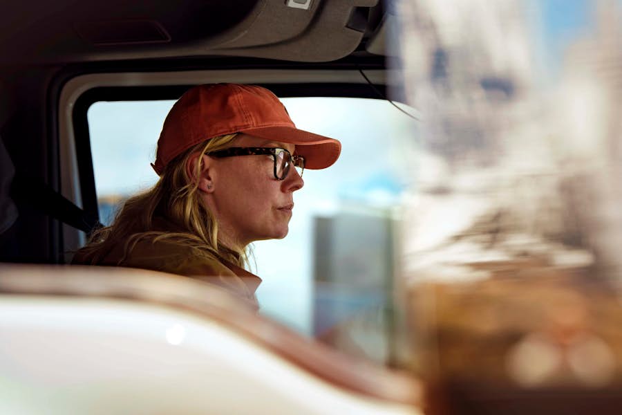international female driver close up driving
