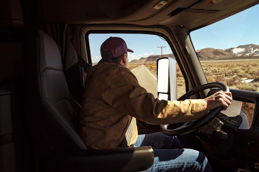 A person driving a truck