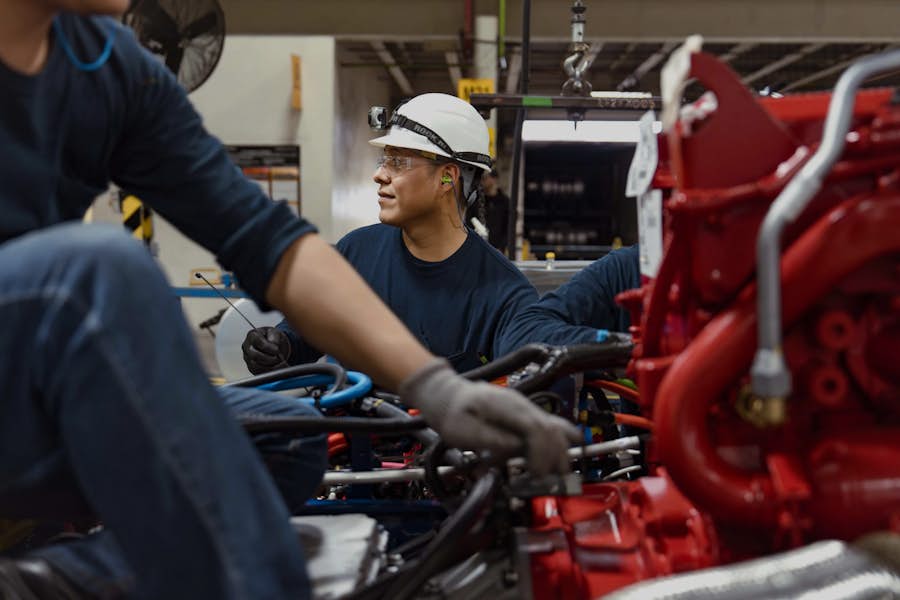A group of people working on a machine