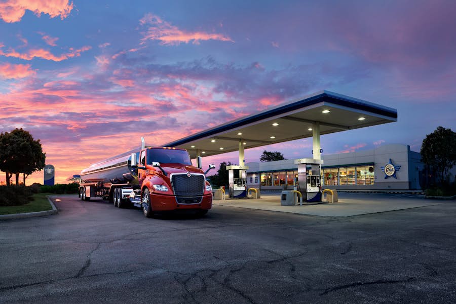 LT Series tanker truck at gas station at sunset